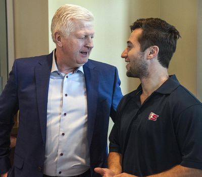 Chiefs general manager Tim Speltz, left, and former Chiefs’ great Tyler Johnson chat before announcement. (Dan Pelle / The Spokesman-Review)