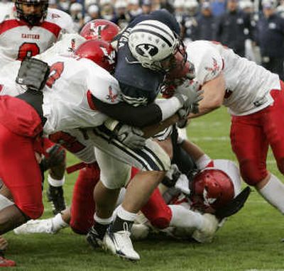 
Brigham Young running back Harvey Unga forces his way through several Eastern Washington players to score.Associated Press
 (Associated Press / The Spokesman-Review)
