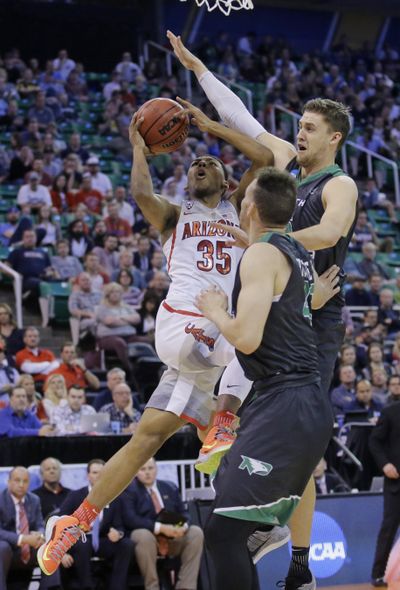 North Dakota's Carson Shanks, right, and Drick Bernstine, center, defend against Arizona guard Allonzo Trier (35) during the second half of a first-round game in the NCAA men's college basketball tournament Thursday, March 16, 2017, in Salt Lake City. (Rick Bowmer / Associated Press)