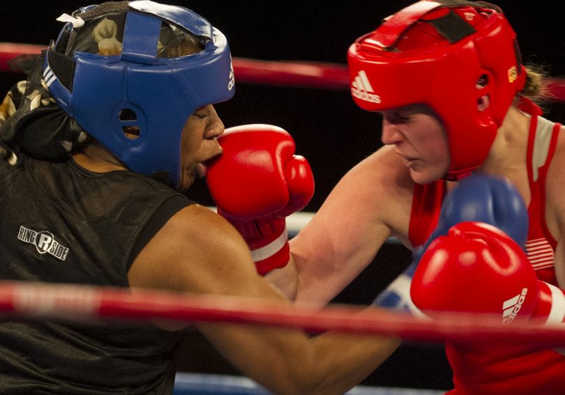 Heidi Henricksen, right, lands a punch on Franchon Crews as the pair battle it out during the 2015 USA Boxing National Championships' Finals on Saturday, Jan 24, 2015, at  Northern Quest Casino in Airway Heights, Wash. (Tyler Tjomsland / The Spokesman-Review)