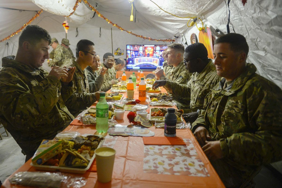 U.S. Army soldiers deployed to the border as part of Operation Faithful Patriot eat Thanksgiving dinner in Donna, Texas, on Thursday, Nov. 22, 2018. Soldiers are providing a range of support including planning assistance, engineering support, equipment and resources to assist the Department of Homeland Security along the southwest U.S. border. (Senior Airman Alexandra Minor / AP)