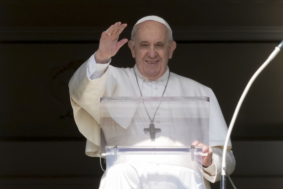 Pope Francis delivers his blessing as he recites the Angelus noon prayer from the window of his studio overlooking St.Peter's Square, at the Vatican, Sunday, Oct. 24, 2021. (Andrew Medichini)