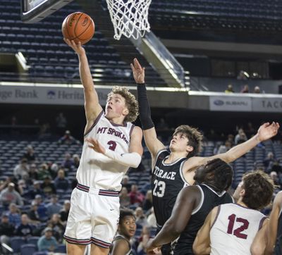 Mt. Spokane guard Ryan Lafferty, left, drives for a layup against Mountlake Terrace during the quarterfinals of the 3A State boys tournament on Feb. 29, 2024 in Tacoma. After spending his first two collegiate seasons at St. Thomas in Minnesota, Lafferty is transferring to Idaho.  (Patrick Hagerty/The Spokesman-Review)