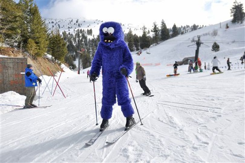 Joe Reitan, of Boise, Idaho comes down the slopes in a Cookie Monster costume during the closing day at Bogus Basin Mountain Recreation Area on Sunday, April 10, 2011 outside Boise. (AP Photo/Idaho Press-Tribune / Charlie Litchfield)