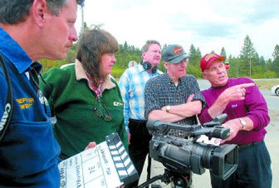 
From left, filmmakers Joe Weihert, Carla Peterman, Ben Hews, Paul Brand and Bob Johnson talk about a shot while on location in Post Falls on Saturday. Johnson and Brand were part of the faculty of a daylong class to plan, write and edit a public service announcement. 
 (Jesse Tinsley / The Spokesman-Review)