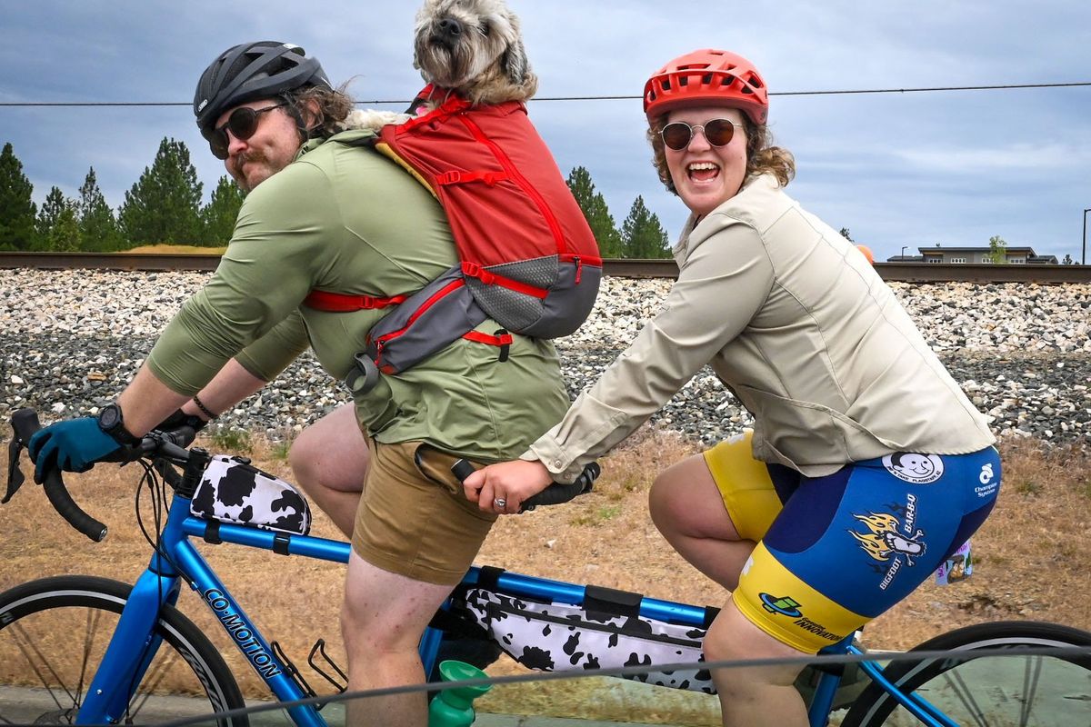 Jimmy Krigbaum and Hannah Six, of Eugene, along with their dog, Risotto, head west on Indiana Avenue on Saturday in Spokane Valley as they ride in the Northwest Tandem Rally. (DAN PELLE/FOR THE SPOKESMAN-REVIEW)