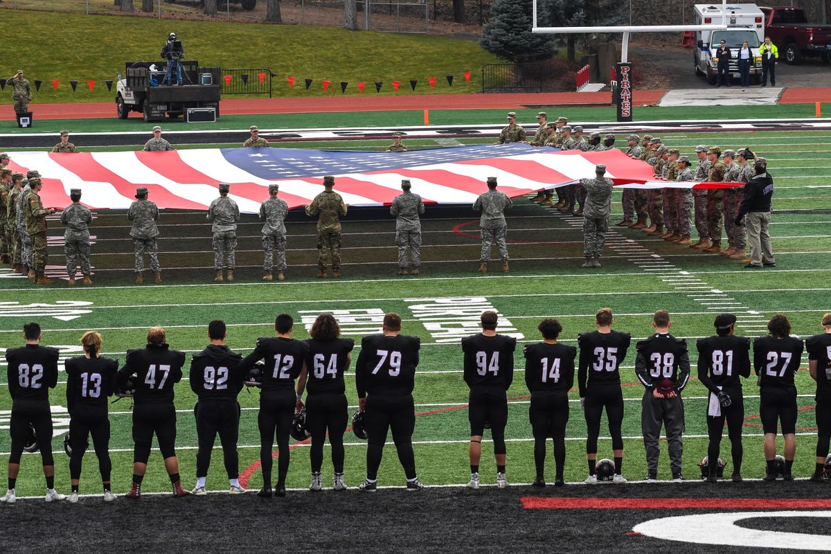 Members of the Bulldog Brigade, consisting of ROTC students from Gonzaga and Whitworth, display the flag before the Whitworth/Linfield game Saturday, Nov. 9, 2019, in the Pine Bowl. (Dan Pelle / The Spokesman-Review)