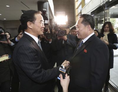 South Korean Unification Minister Cho Myoung-gyon, left, shakes hands with the head of North Korean delegation Ri Son Gwon before their meeting at the Panmunjom in the Demilitarized Zone in Paju, South Korea, Tuesday, Jan. 9, 2018. (Associated Press)