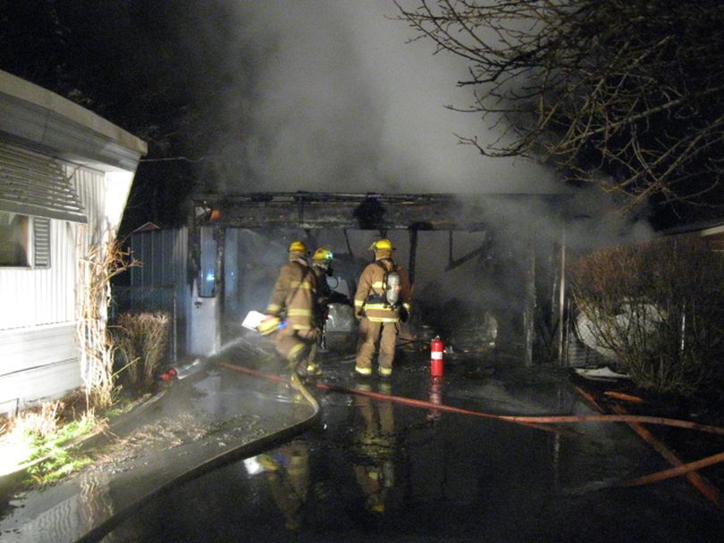 Spokane Valley firefighters responded to this garage fire in the 6500 block of East Seventh just after 4 a.m. on March 22, 2012.  (Photo courtesy the Spokane Valley Fire Department)