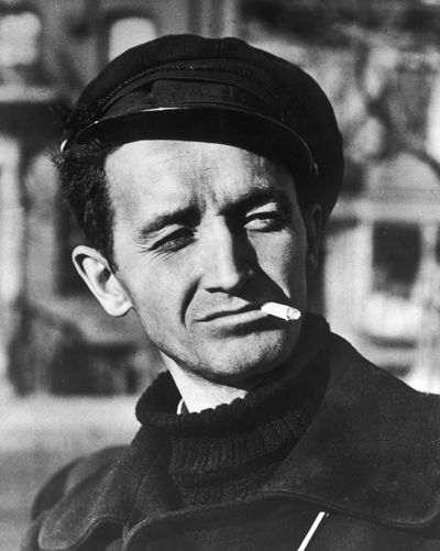 American singer and musician Woody Guthrie (1912 - 1967) smoking a cigarette and squinting outdoors, c. 1960. Woody Guthrie's family want Sen. Josh Hawley to stop using his lyrics. (Getty Images/Hulton Archive/Getty Images Nort/TNS)