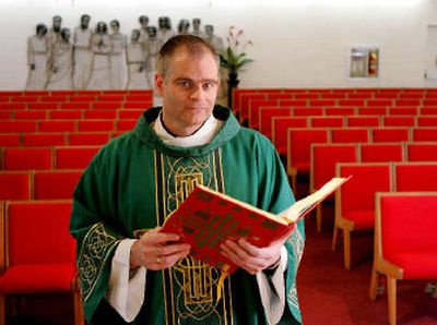 
The Rev. Brendan McGuire stands inside the Holy Spirit Church in San Jose, Calif. McGuire was the executive director of the Personal Computer Memory Card International Association before becoming a priest. He has brought business practices, like employee evaluations, to Holy Spirit, a parish of more than 4,000. 
 (Associated Press / The Spokesman-Review)