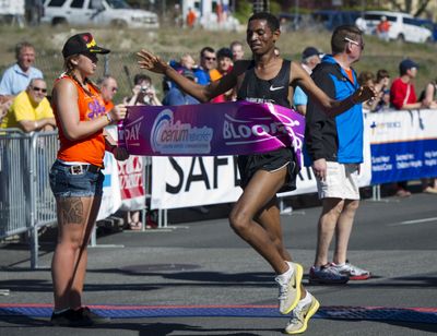 Ethiopia’s Belete Assefa crosses the finish line to win Bloomsday men’s elite race in 2013. (Colin Mulvany)