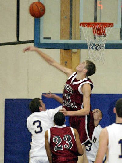 
North Central High School senior Justin Anderson, a 6-foot-7 post, plays against Mead High School in a recent game. 
 (Photo courtesy of Todd Conley / The Spokesman-Review)