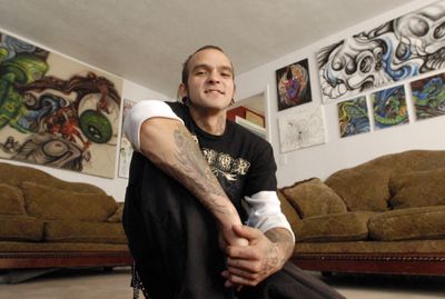 Jeremy Bevers is an airbrush  and tattoo artist. His look reflects his work. He calls his style graffiti mixed with traditional. “I’ve always been fascinated with the human skull,” he said. “In the beginning you get life and in the end you end up in a pile of bones in the ground.”  (J. BART RAYNIAK / The Spokesman-Review)