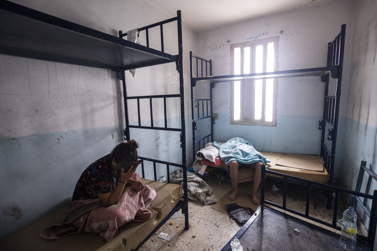Minors who crossed into Spain take shelter inside an abandoned building in Ceuta, Friday, May 21, 2021. Spain says it has returned to Morocco over 6,600 of the more than 8,000 migrants who swam or jumped over border fences into one of Spain