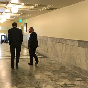 House Health & Welfare Committee Chairman Fred Wood, right, talks with Idaho Gov. Butch Otter, left, in a Capitol hallway after the House panel sent Otter's health care bill back out to the full House, from which it had been pulled two weeks earlier without a vote. (The Spokesman-Review / Betsy Z. Russell)