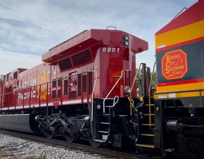 A train with Kansas City Southern and Canadian Pacific locomotives joined rolled through Camanche, Iowa, last fall.  (Tribune News Service)