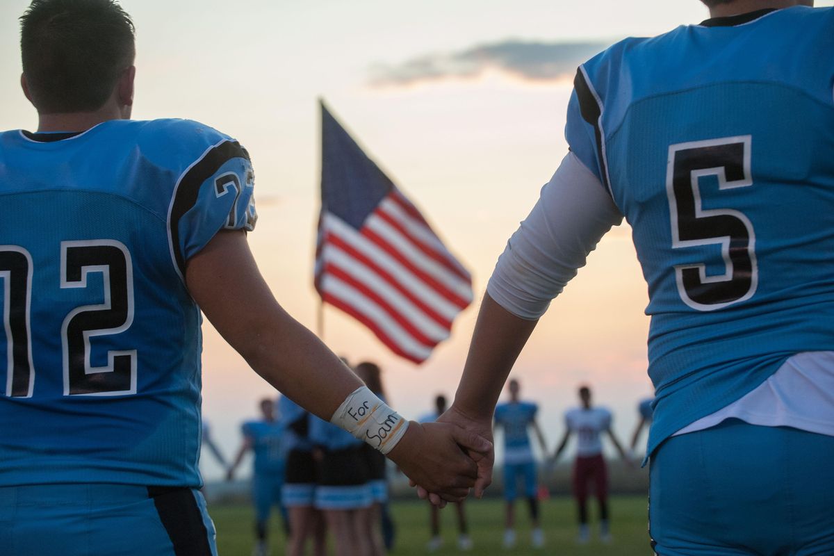 Tyler Tjomsland’s photo of a memorial for Sam Strahan before a Freeman High football game won a second place in Metro News. 

Freeman