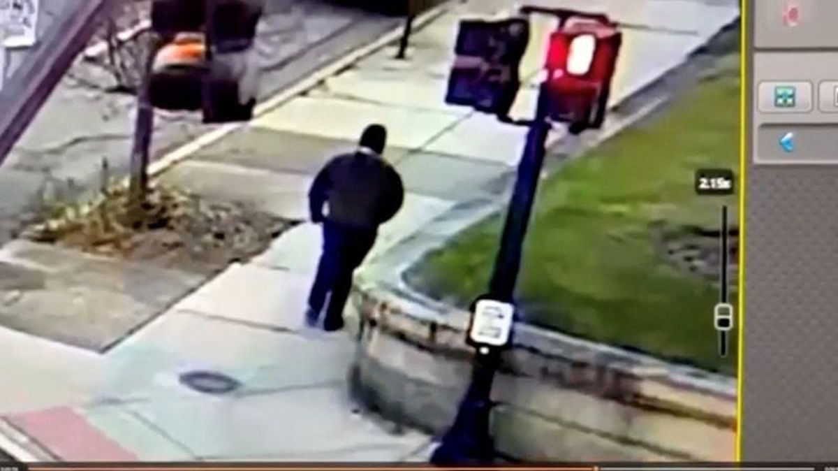 A monitor shows security camera footage of what police say is the Brown University shooting suspect walking along Hope Street after leaving the scene of shooting, in this screengrab taken from a handout video released December 13, 2025. Providence Public Information Officer/Handout via REUTERS  (PROVIDENCE PUBLIC INFORMATION OF)