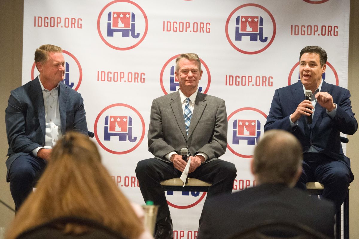 Idaho representative Raul Labrador, right, speaks as Lieutenant Governor Brad Little, center, and Tommy Ahlquist, left, listen during a forum meeting for Idaho candidates for governor hosted by Idaho GOP on Friday, July 21, 2017, at the Best Western in Coeur d