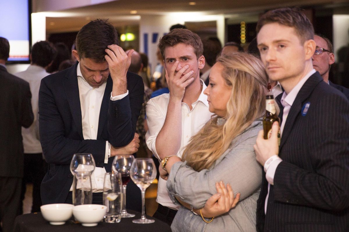 Supporters of the “Stronger In” campaign react after hearing results Friday in the EU referendum at London’s Royal Festival Hall. (Rob Stothard / Associated Press)
