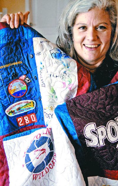 
Melissa Pittz included her son's Boy Scout uniform, with badges, on the quilt she made for his 18th birthday.
 (Holly Pickett/the spokesman-review / The Spokesman-Review)
