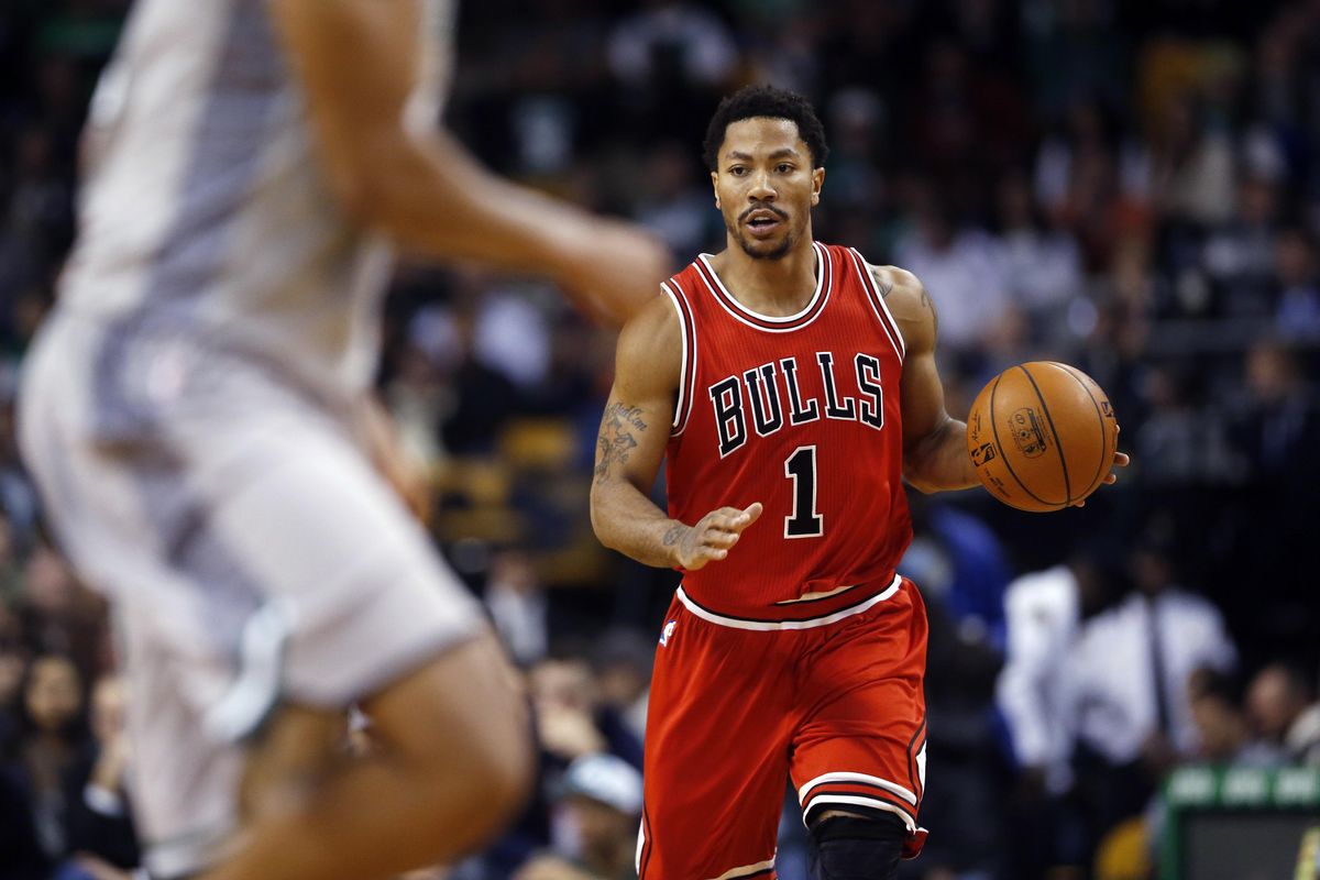 Chicago Bulls guard Derrick Rose dribbles the ball in the first half of a basketball game against the Boston Celtics in Boston, Friday, Nov. 28, 2014. (Elise Amendola / Associated Press)