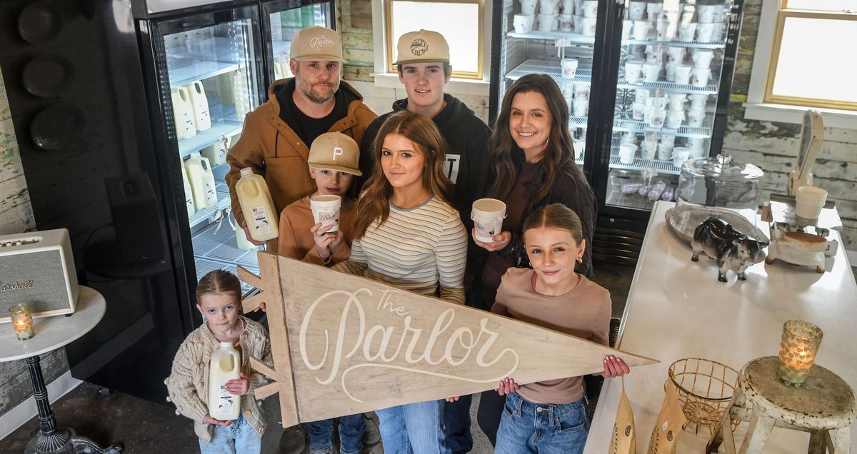 The Zeigler family, from left front row, Georgia, 5, Jet, 10, Jade, 16, and Bristol, 12, and from left back row, Dennis, Brayton, 17, and Rachel, are photographed Friday at their family business, the Parlor. The family has a first-generation dairy farm, creamery and storefront in Harrington and Spokane.  (Kathy Plonka/The Spokesman-Review)