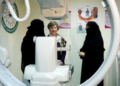 
First lady Laura Bush listens to Dr. Huda Abdel Kareem, right, and an unidentified Saudi female doctor Tuesday during a visit to Saudi Arabia.Associated Press
 (Associated Press / The Spokesman-Review)