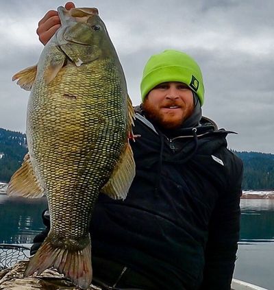 Joey Walton of Lewiston with a 9.1-pound, 23.75-inch smallmouth bass he caught at Dworshak Reservoir last month. The fish set the Idaho catch-and-release record for smallmouth.  (Courtesy of Joey Walton)