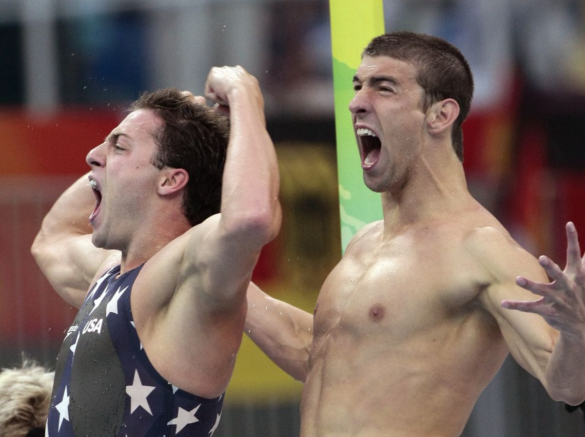 United States’ Michael Phelps, right, and Garret Weber-Gale celebrate their team’s gold in the men’s 4x100-meter freestyle relay.  (Associated Press / The Spokesman-Review)