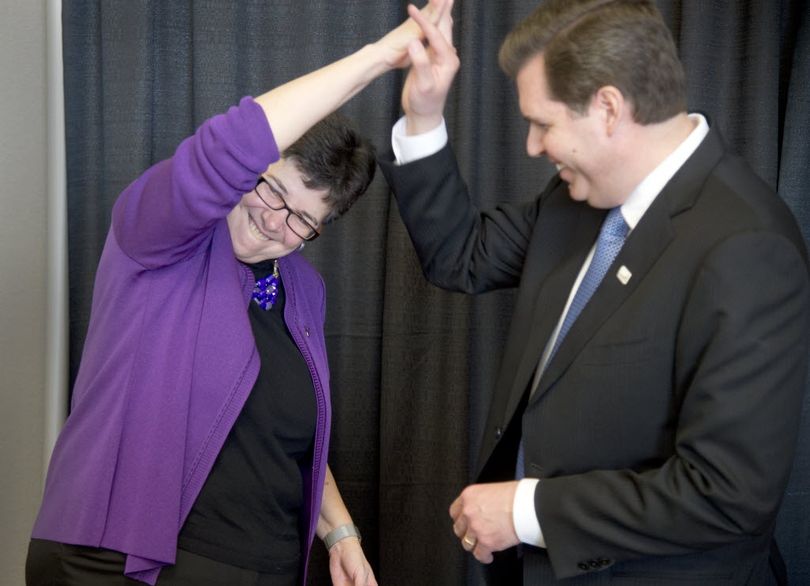 University of Washington President Ana Marie Cauce, left, and Gonzaga University President Thayne McCulloh share a high five after the announcement that Gonzaga University would host UW medical students on campus, starting in the fall of 2016. The announcement was Wednesday, Feb. 24, 2016 at Gonzaga University.  (Jesse Tinsley)