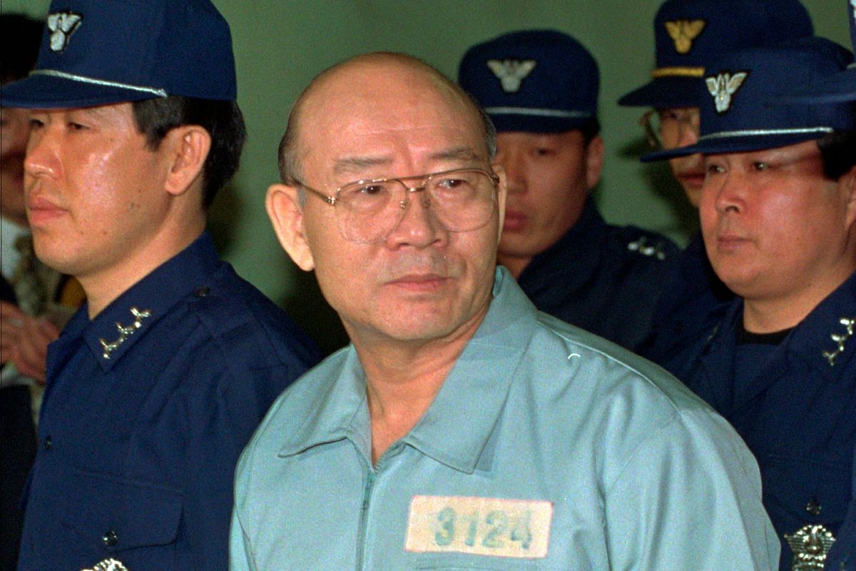 FILE - Former South Korean President Chun Doo-hwan enters the Seoul Court House dressed in prison garb for his first trial on corruption charges, in Seoul, South Korea, on Feb. 26, 1996. Former South Korean military strongman Chun, who crushed pro-democracy demonstrations in 1980, has died on Tuesday, Nov. 23, 2021. He was 90.  (Yun Jai-hyoung)