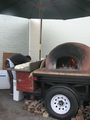 Veraci Pizza is firing up the terra cotta oven with apple wood - dough is rising... smells heavenly already. (Pia Hallenberg)