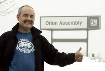 
Tom Hoppe shows gestures outside the General Motors Orion Assembly in Orion Township, Mich., last month. Hoppe started working for GM 28 years ago at a plant in Ypsilanti. He was laid off and transferred to an Ohio plant, but returned until GM closed his plant in 1993. He moved his family to take a job at a GM plants Saturn plant in Tennessee. But he moved back to Michigan in 2000, believing that layoffs were coming. He got a job at the Orion plant, until a shift was eliminated in 2002 and he transferred to plant in Pontiac. That plant eliminated his shift and he came back to Orion. He expects to lose that job this April when the plant scales back production, sending him to another Michigan plant. 
 (Associated Press / The Spokesman-Review)
