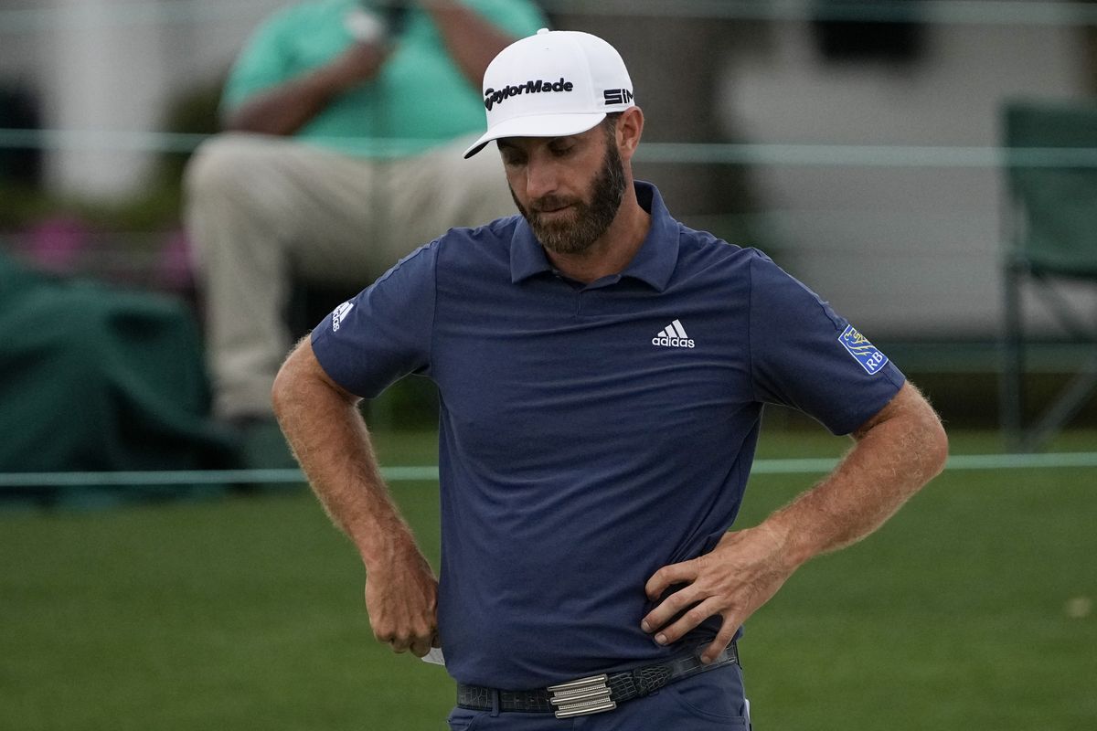 Dustin Johnson looks down after putting on the 18th hole during the second round of the Masters golf tournament on Friday, April 9, 2021, in Augusta, Ga.  (Associated Press)