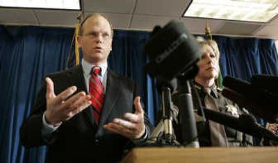 
King County Prosecutor Dan Satterberg, left, and Sheriff Sue Rahr  explain the charges filed Friday in Seattle against a couple accused of killing six members of the woman's family. Associated Press
 (Associated Press / The Spokesman-Review)