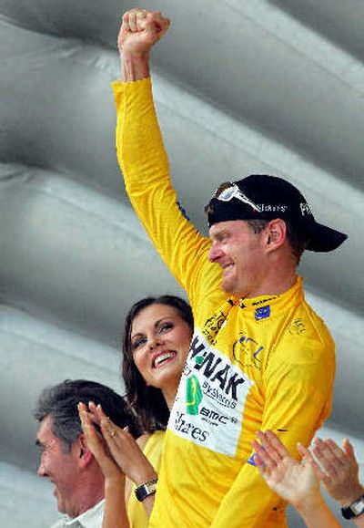 
New overall leader Floyd Landis of the U.S. reacts on the podium after the 19th stage of the 93rd Tour de France.  
 (Associated Press / The Spokesman-Review)
