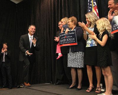 Republican David Jolly heads to the stage to thank his supporters in the special election for the House seat Tuesday at the Sheraton Sand Key Resort, in Clearwater Beach, Fla. (Associated Press)