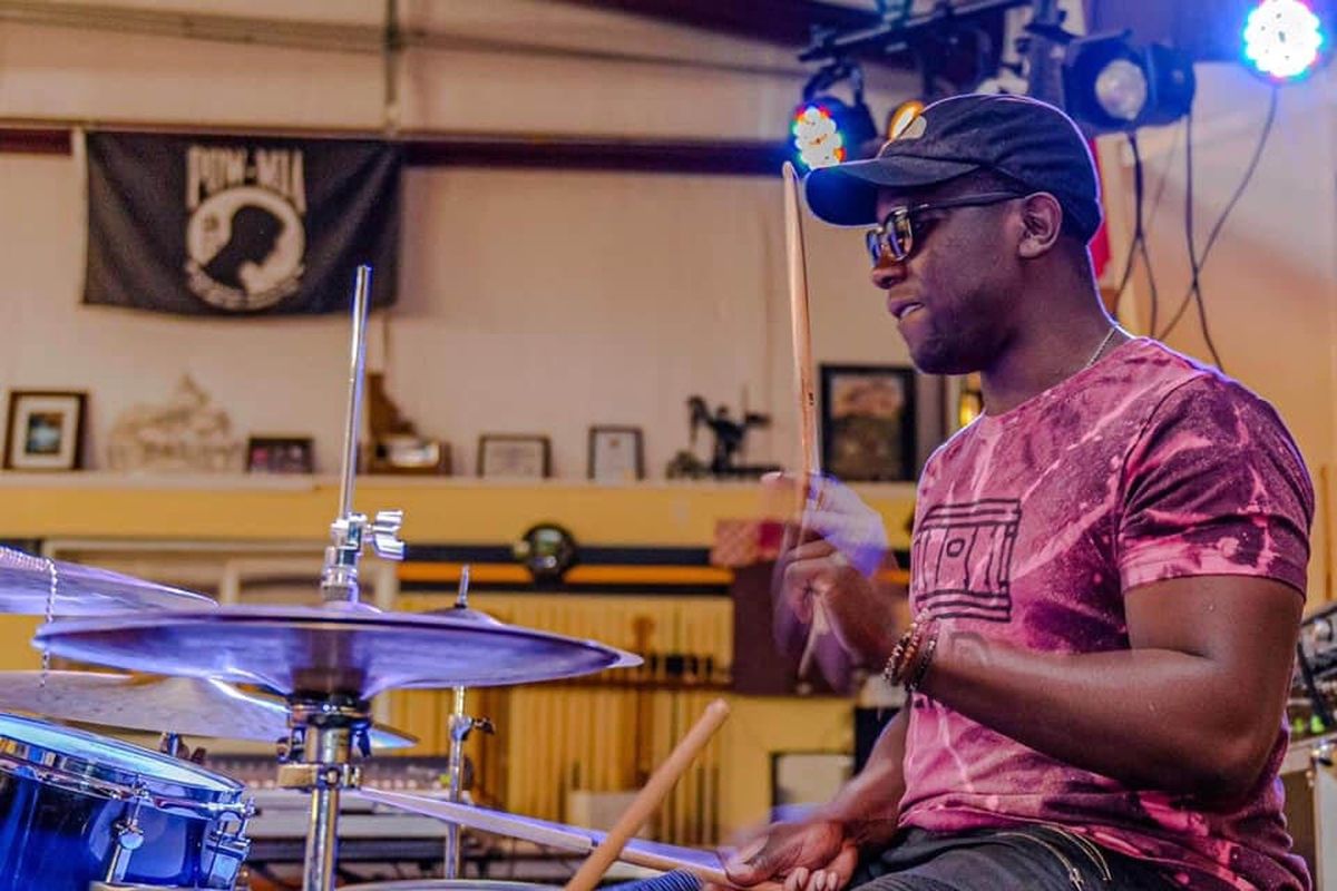 Jazz musician Quindrey “Drey” Davis dons sunglasses as he plays the drums. Davis died suddenly last week after a leukemia diagnosis.  (Courtesy of the family of Quindrey Davis)