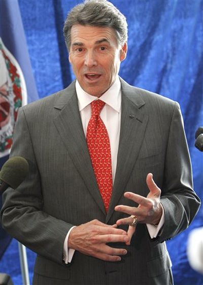Republican Presidential candidate, Texas Gov. Rick Perry, gestures during news conference after a speech before a Virginia Republican fundraising event in Richmond, Va., Wednesday, Sept. 14, 2011. ( (AP Photo/Steve Helber))