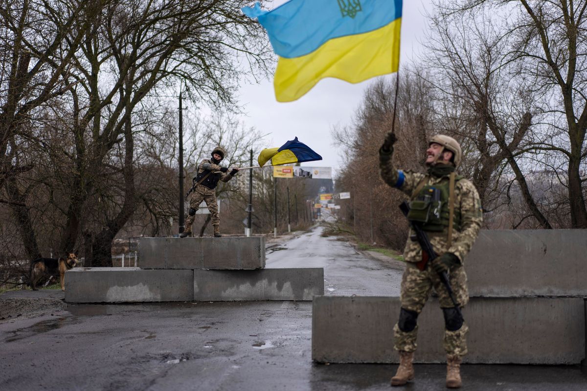 FILE - Ukrainian soldiers celebrate at a check point in Bucha, in the outskirts of Kyiv, Ukraine, April 3, 2022. Kyiv was a Russian defeat for the ages. It started poorly for the invaders and went downhill from there.  (Rodrigo Abd)