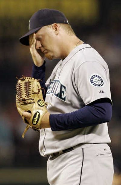 
Seattle closer J.J. Putz can't stand to watch after giving up a two-run home run to the Texas Rangers' Ramon Vazquez in the eighth inning of Wednesday's game. The M's lost 7-6. Associated Press
 (Associated Press / The Spokesman-Review)