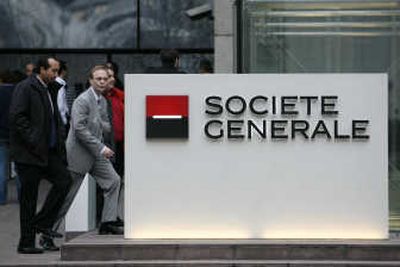 
Associated Press People enter the headquarters building of French bank Societe Generale on Thursday  outside Paris.
 (Associated Press / The Spokesman-Review)