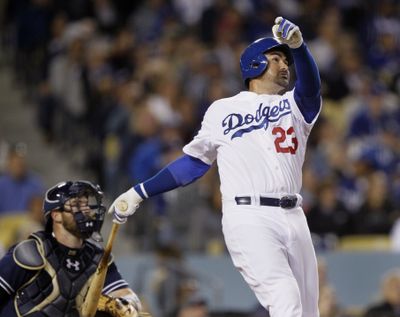 Los Angeles Dodgers first baseman Adrian Gonzalez watches his solo home run take off in the fifth inning. (Associated Press)