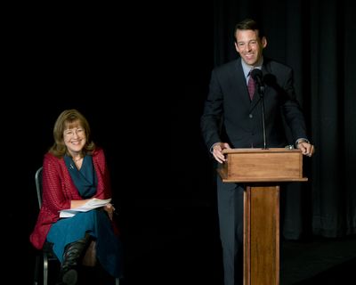Nancy McLaughlin and Andy Billig gather for a debate Wednesday during a luncheon for the Spokane Building Owners and Managers Association. (Dan Pelle)