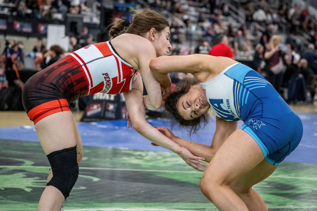 Raenah Smith, 15, right, with Lionheart Wrestling Club of Spokane, grapples with Paige Jox from Pittsburgh in the U17 Division during the USA Wrestling’s Women’s National Championship on Friday in the Podium.  (COLIN MULVANY/THE SPOKESMAN-REVIEW)