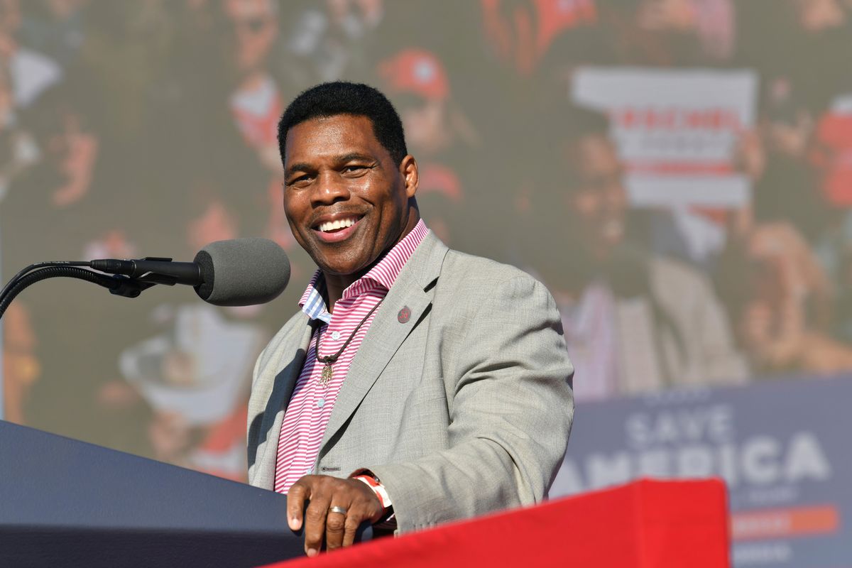 FILE – Republican U.S. Senate candidate Herschel Walker speaks during a Donald Trump rally for Georgia GOP candidates in Commerce, Ga., March 26, 2022. Walker boasts of his charity work helping members of the military who struggle with mental health. The football legend and leading Republican Senate candidate in Georgia says the outreach is done through a program he created, called Patriot Support. But court filings and company documents offer a more complicated picture.  (Hyosub Shin)