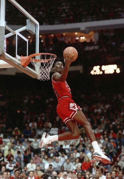 In this Feb. 6, 1988 photo, Chicago Bulls' Michael Jordan dunks during the slam-dunk competition of the NBA All-Star weekend in Chicago. (John Swart / Associated Press)