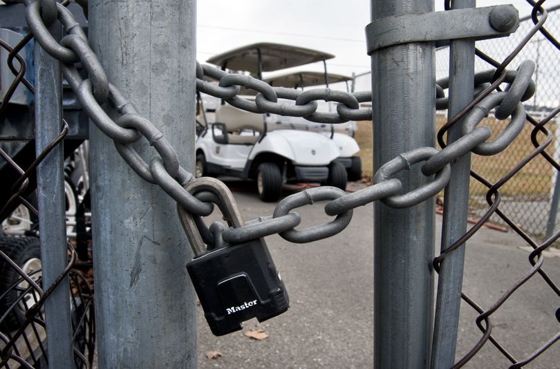 Golf carts sit locked behind a fence at Painted Hills Golf Course back in March. (File)